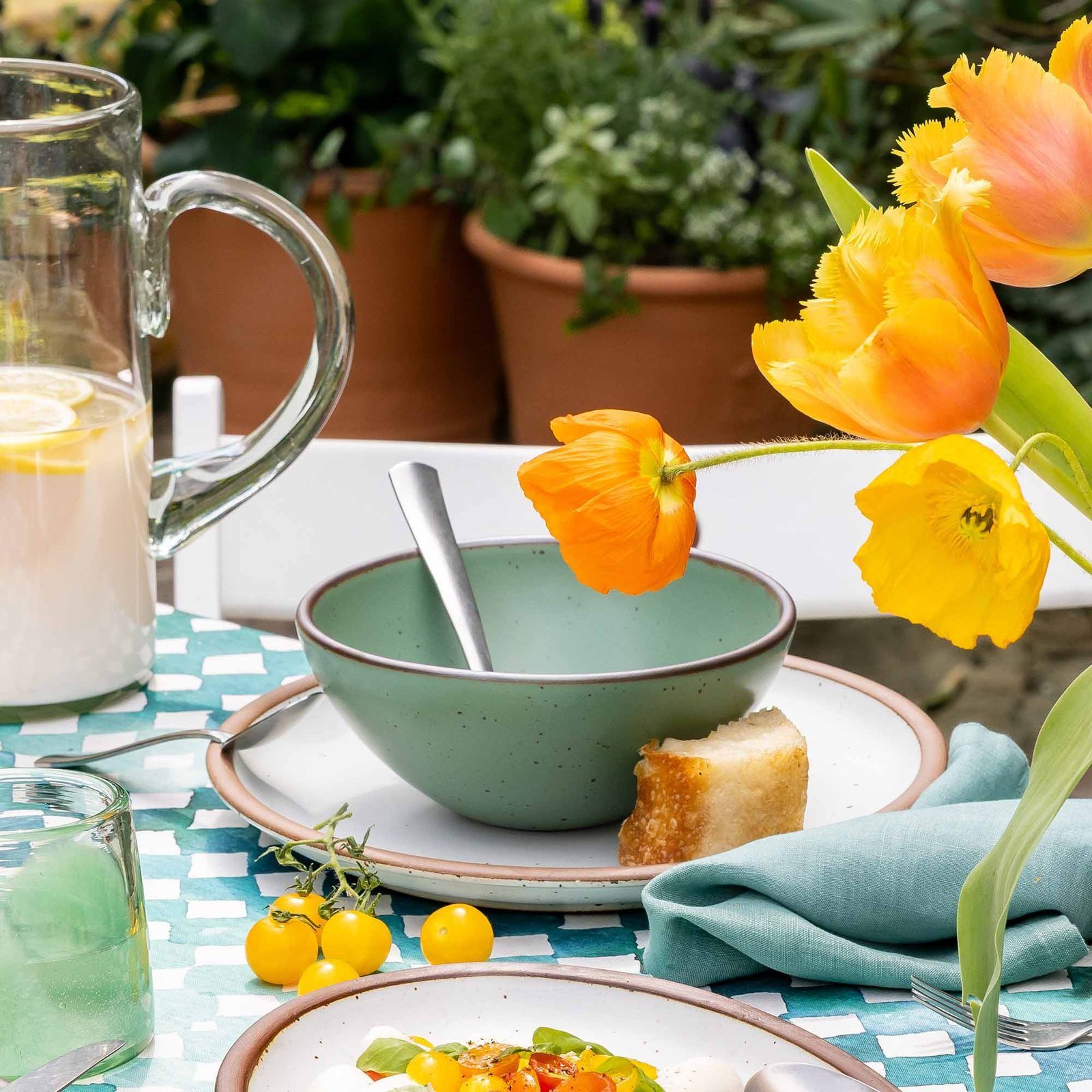 gardengox soup bowl in Viridian, in an outdoor table setting
